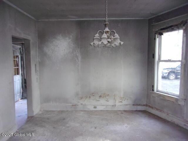 1745 Becker St, Schenectady, NY 12304 - unfurnished dining area with a chandelier, unfinished concrete floors, and plenty of natural light