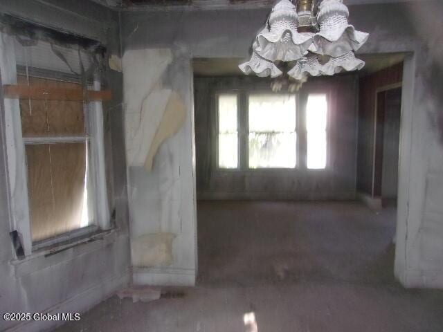 1745 Becker St, Schenectady, NY 12304 - unfurnished room featuring a chandelier