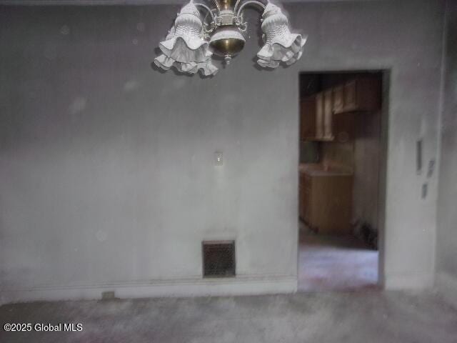 1745 Becker St, Schenectady, NY 12304 - unfurnished dining area featuring a chandelier