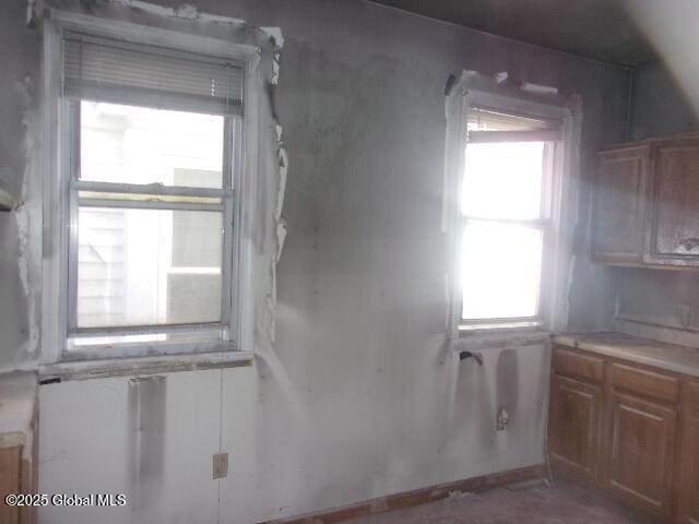 1745 Becker St, Schenectady, NY 12304 - kitchen with brown cabinetry and light countertops