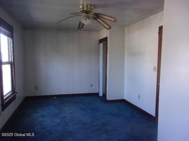 1745 Becker St, Schenectady, NY 12304 - unfurnished room featuring ceiling fan, baseboards, and dark carpet