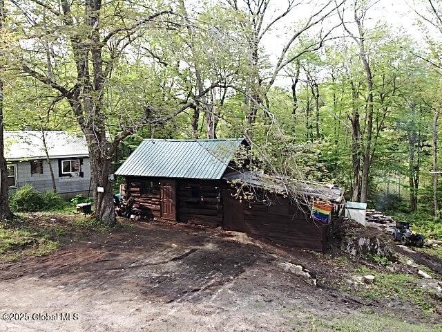 5244 State Highway 29a, Stratford, NY 13470 - view of outdoor structure featuring a wooded view