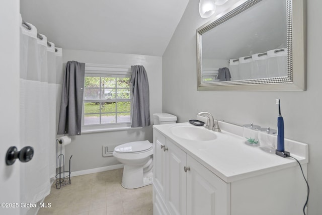 1920 Dover Rd, Niskayuna, NY 12309 - bathroom featuring vanity, toilet, tile patterned flooring, baseboards, and vaulted ceiling