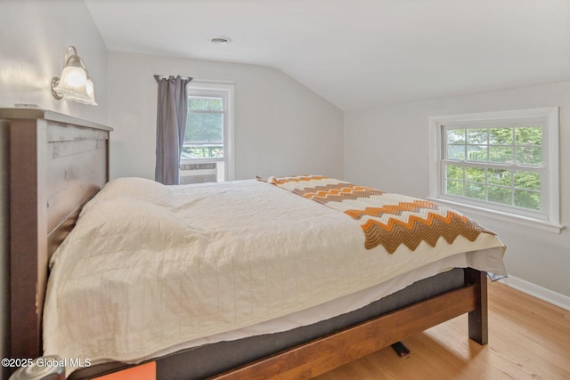 1920 Dover Rd, Niskayuna, NY 12309 - bedroom featuring wood finished floors, vaulted ceiling, and baseboards