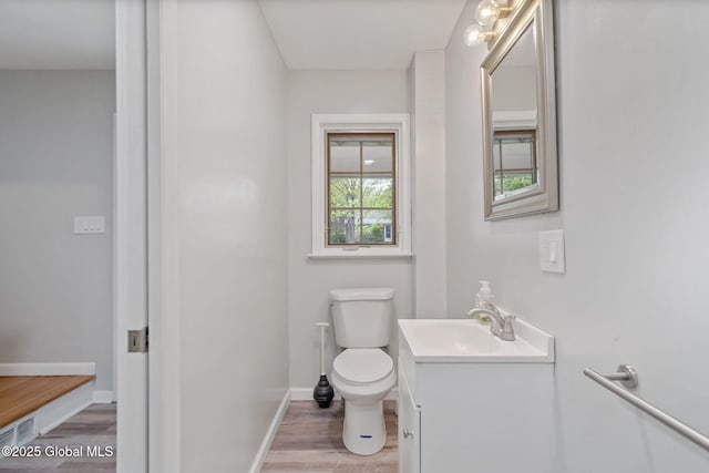 1920 Dover Rd, Niskayuna, NY 12309 - bathroom with toilet, vanity, wood finished floors, and baseboards