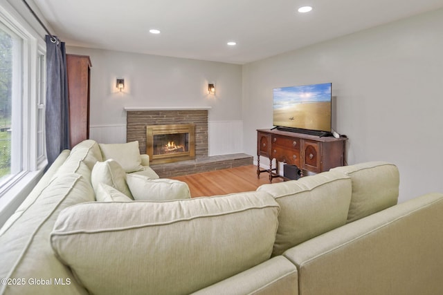 1920 Dover Rd, Niskayuna, NY 12309 - living room featuring wood finished floors, plenty of natural light, a fireplace, and recessed lighting