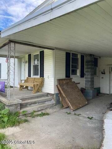 1019 Brand Rd, Root, NY 12166 - view of exterior entry with a porch