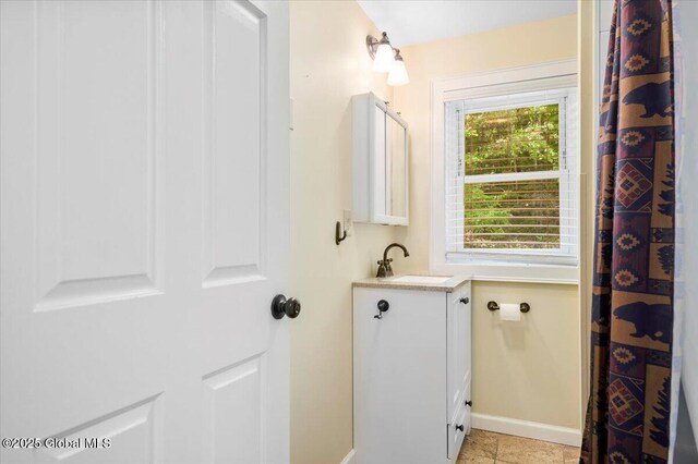 113 New Vermont Rd, Bolton, NY 12814 - full bath featuring vanity, baseboards, and tile patterned flooring