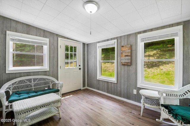 113 New Vermont Rd, Bolton, NY 12814 - sitting room featuring plenty of natural light, wood finished floors, baseboards, and wooden walls