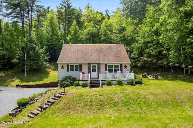 113 New Vermont Rd, Bolton, NY 12814 - cape cod house with a front yard, a deck, and a forest view
