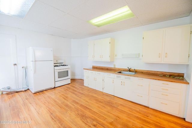56 Boulevard, Queensbury, NY 12804 - kitchen featuring white appliances, a paneled ceiling, a sink, and light wood finished floors