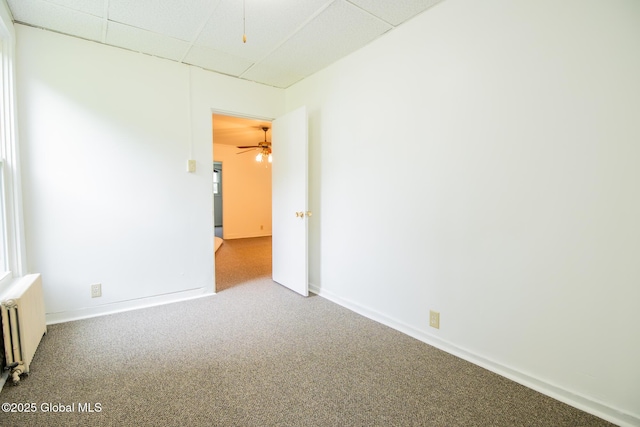 56 Boulevard, Queensbury, NY 12804 - carpeted empty room with radiator, a drop ceiling, a ceiling fan, and baseboards