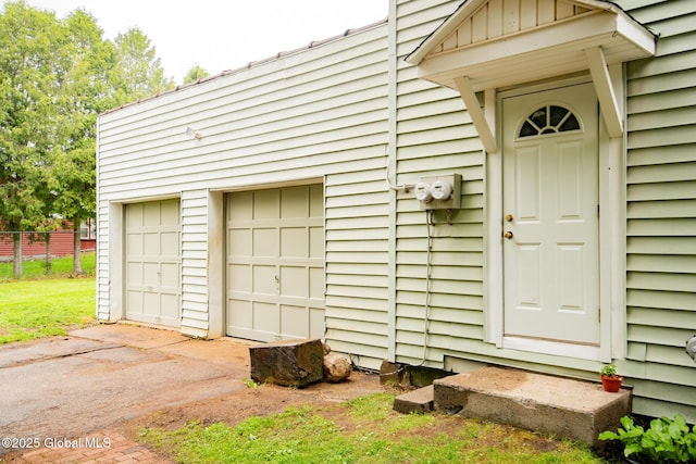 56 Boulevard, Queensbury, NY 12804 - entrance to property with a garage, driveway, and board and batten siding