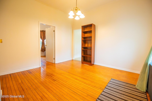 56 Boulevard, Queensbury, NY 12804 - empty room with a chandelier, light wood finished floors, and baseboards