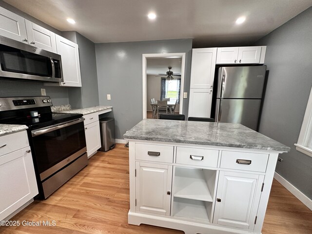 134 Moyer St, Canajoharie, NY 13317 - kitchen with appliances with stainless steel finishes, light wood-type flooring, white cabinets, and recessed lighting