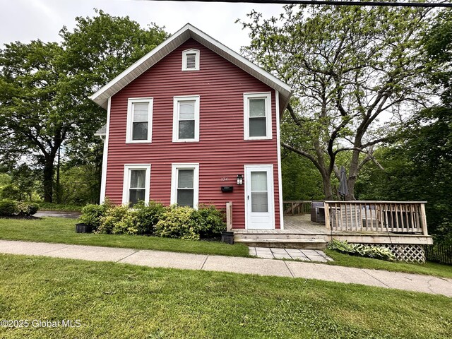 134 Moyer St, Canajoharie, NY 13317 - view of front facade featuring a wooden deck and a front lawn