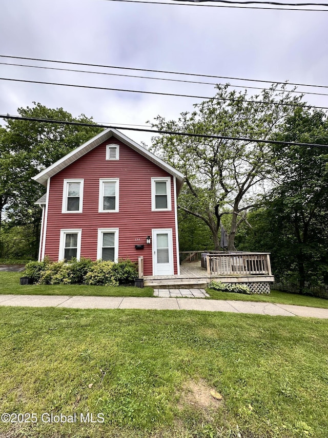 134 Moyer St, Canajoharie, NY 13317 - view of front facade featuring a front lawn and a wooden deck
