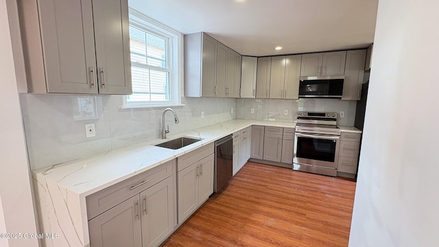 27 Major Dickinson Ave, Stillwater, NY 12170 - kitchen with appliances with stainless steel finishes, a sink, gray cabinets, tasteful backsplash, and light stone countertops