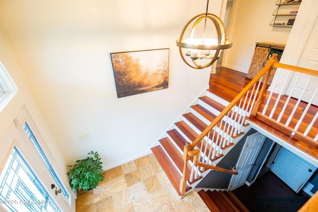 16 Dinu Dr, Warrensburg, NY 12885 - stairway featuring a chandelier and baseboards