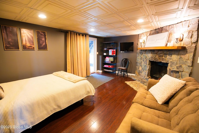 16 Dinu Dr, Warrensburg, NY 12885 - bedroom with an ornate ceiling, a fireplace, wood finished floors, and recessed lighting