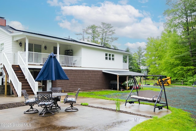 16 Dinu Dr, Warrensburg, NY 12885 - view of patio / terrace with stairway and outdoor dining area