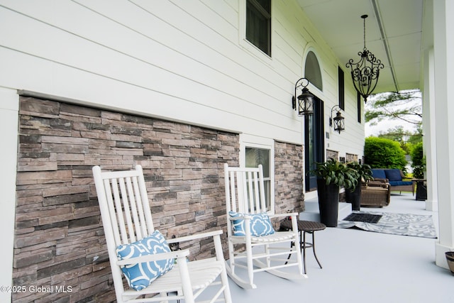 16 Dinu Dr, Warrensburg, NY 12885 - covered porch with an outdoor hangout area