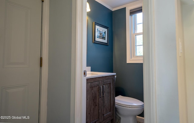 95 Jordan Blvd, Bethlehem, NY 12054 - bathroom featuring vanity, toilet, and ornamental molding