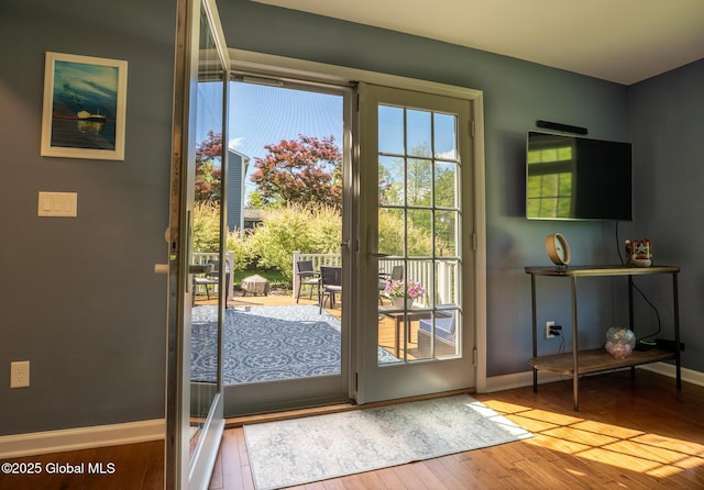 95 Jordan Blvd, Bethlehem, NY 12054 - doorway to outside featuring baseboards and hardwood / wood-style flooring