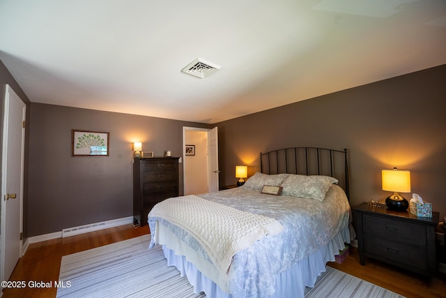 95 Jordan Blvd, Bethlehem, NY 12054 - bedroom with wood finished floors, baseboards, and a baseboard heating unit