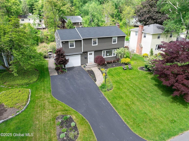 95 Jordan Blvd, Bethlehem, NY 12054 - colonial-style house with driveway, an attached garage, a front yard, and roof with shingles