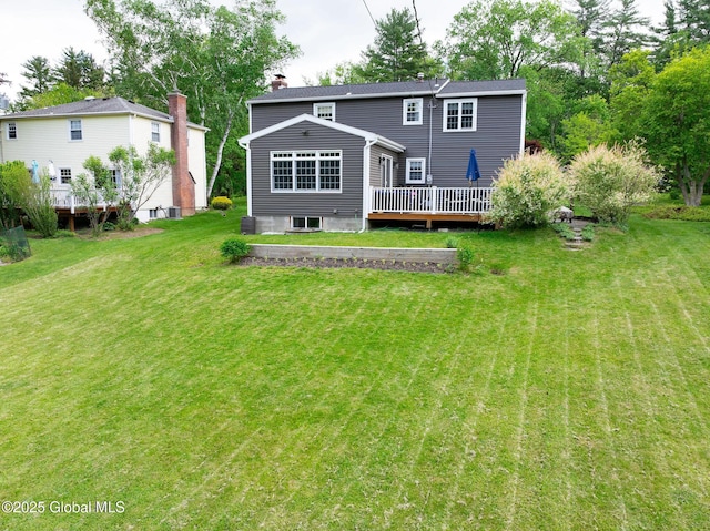 95 Jordan Blvd, Bethlehem, NY 12054 - rear view of property featuring a wooden deck, a lawn, and a chimney