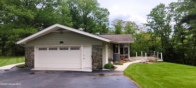 22 E Rd, Brunswick, NY 12180 - view of front facade with stone siding, asphalt driveway, a front yard, and a wooden deck