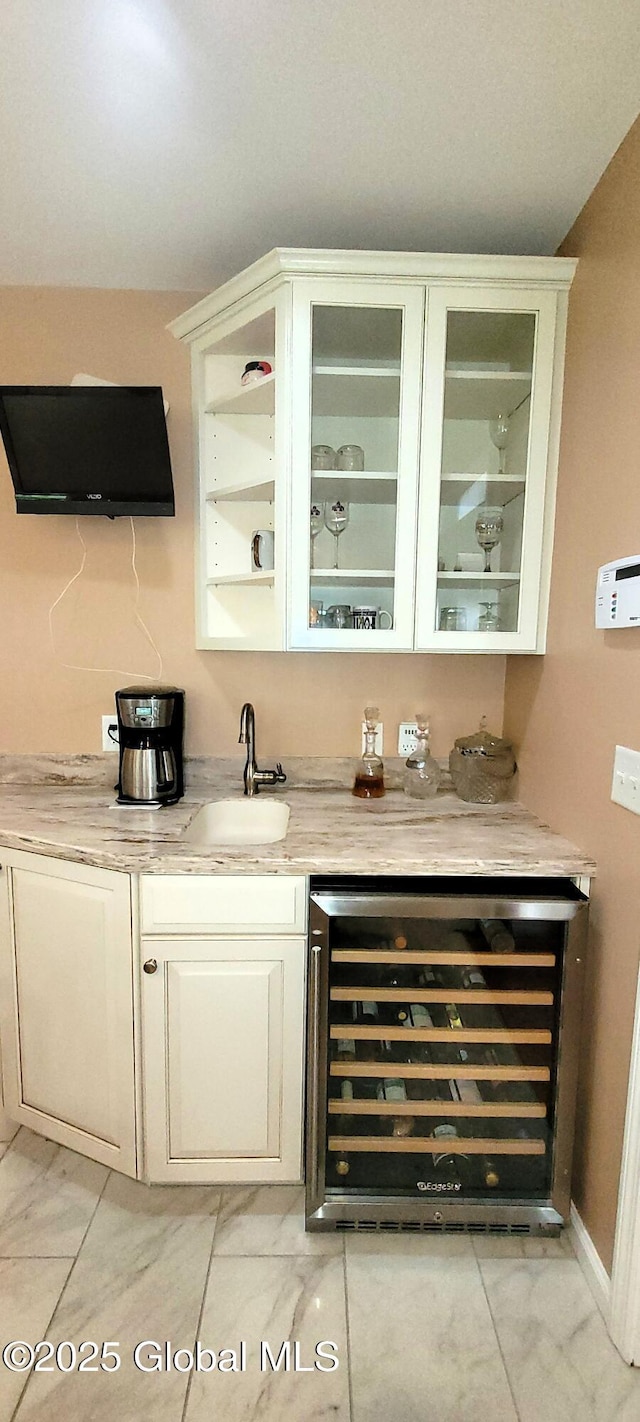 22 E Rd, Brunswick, NY 12180 - indoor bar featuring beverage cooler, light marble finish floors, and baseboards
