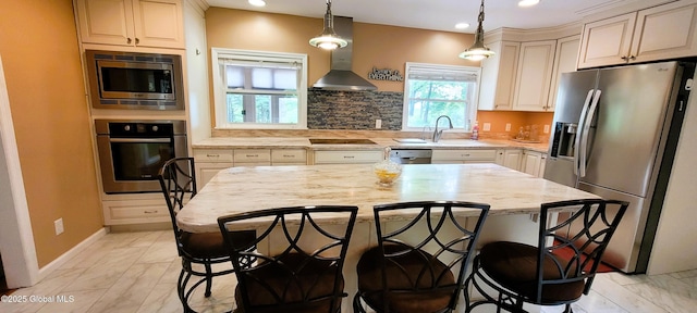 22 E Rd, Brunswick, NY 12180 - kitchen featuring stainless steel appliances, wall chimney range hood, a breakfast bar area, recessed lighting, and light stone counters