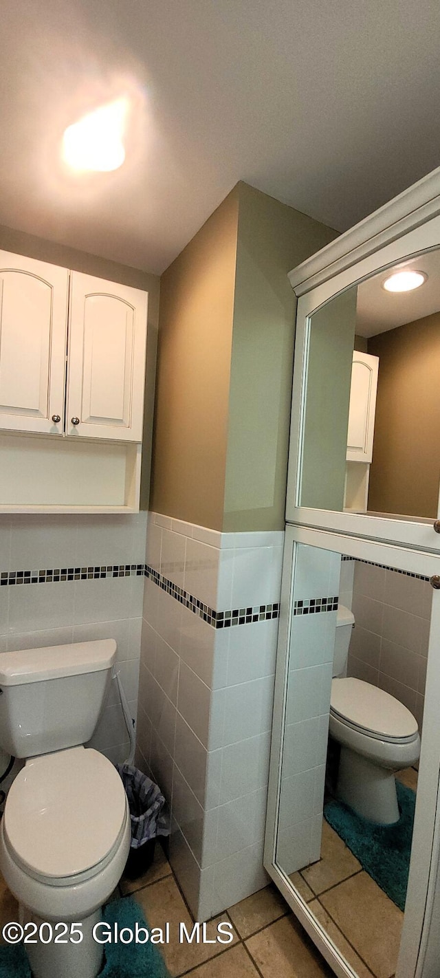 22 E Rd, Brunswick, NY 12180 - bathroom featuring tile walls, toilet, tile patterned flooring, and a wainscoted wall