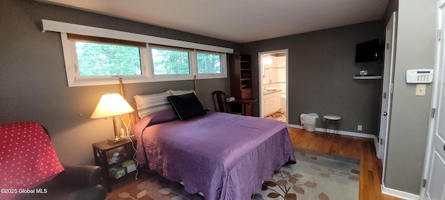 22 E Rd, Brunswick, NY 12180 - bedroom featuring wood finished floors and connected bathroom