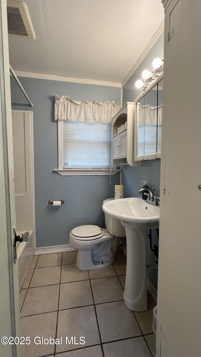 209 Hudson Ave E, East Greenbush, NY 12144 - full bathroom with toilet, tile patterned floors, ornamental molding, bathtub / shower combination, and baseboards