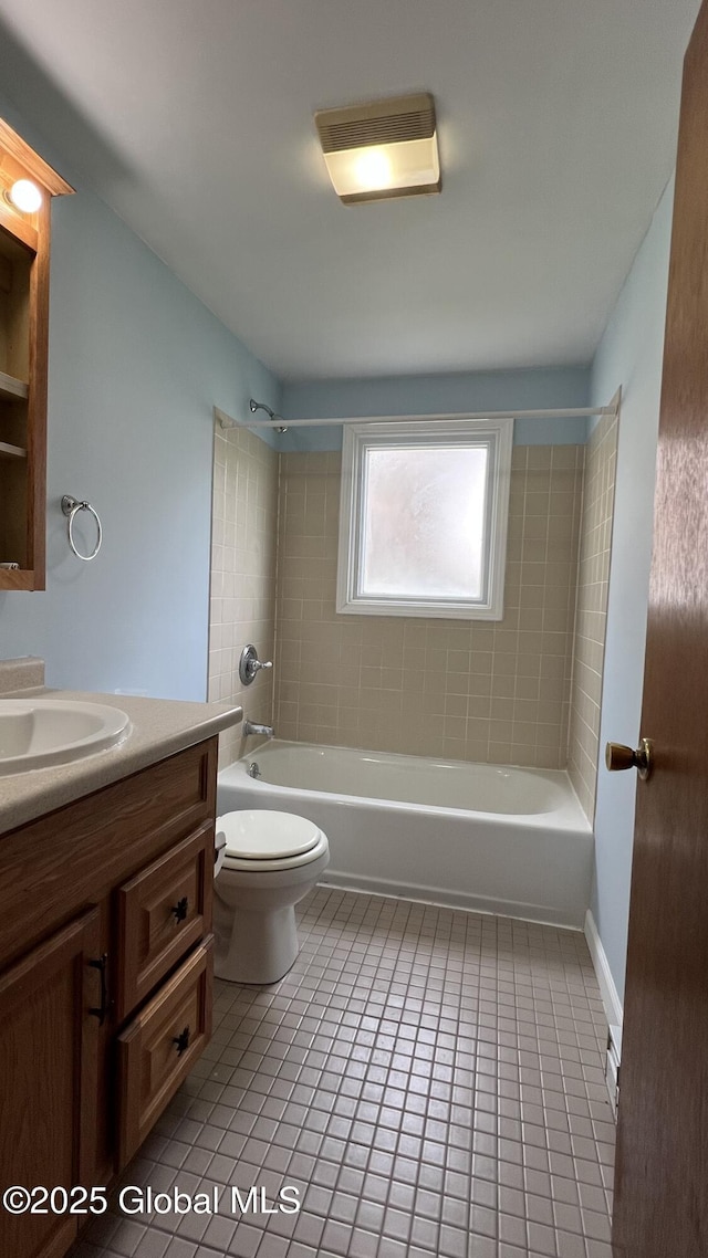 209 Hudson Ave E, East Greenbush, NY 12144 - bathroom featuring vanity, tile patterned flooring, toilet, and shower / washtub combination