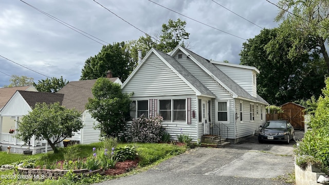 209 Hudson Ave E, East Greenbush, NY 12144 - view of front of property featuring roof with shingles and asphalt driveway