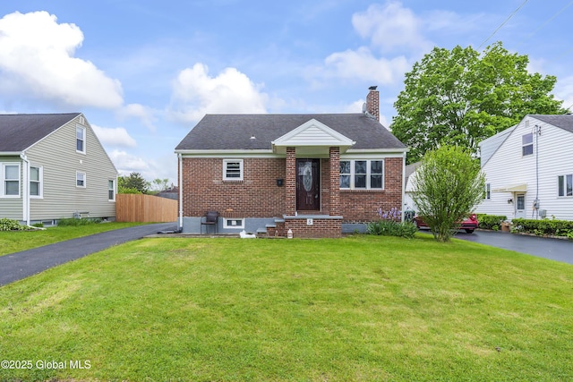 5 Brigadier St, Colonie, NY 12205 - view of front facade with brick siding, a chimney, and roof with shingles