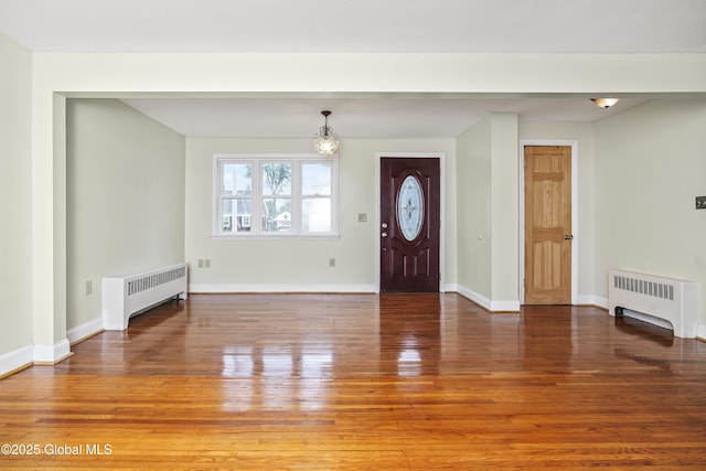 5 Brigadier St, Colonie, NY 12205 - entrance foyer featuring radiator, wood finished floors, and baseboards
