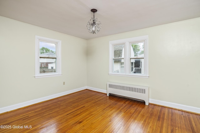 5 Brigadier St, Colonie, NY 12205 - unfurnished room featuring radiator heating unit, healthy amount of natural light, and baseboards