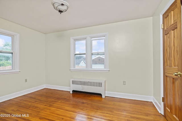 5 Brigadier St, Colonie, NY 12205 - unfurnished bedroom featuring radiator heating unit, light wood-style flooring, and baseboards