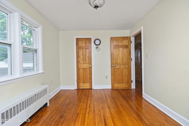 5 Brigadier St, Colonie, NY 12205 - unfurnished room with radiator, baseboards, and wood-type flooring