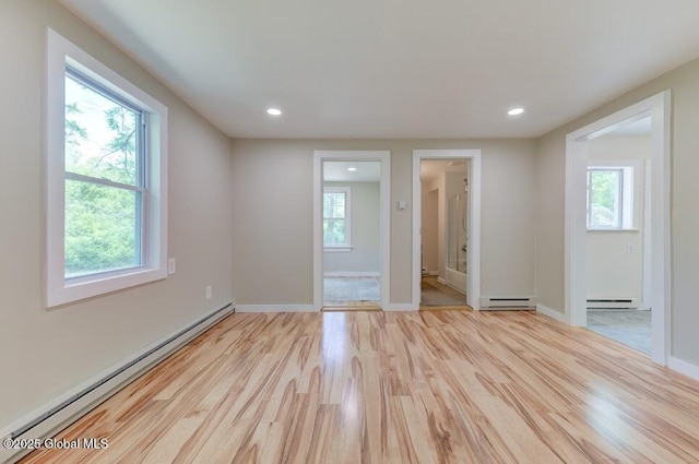 3956 Rte 9 W, Saugerties, NY 12477 - empty room featuring a baseboard heating unit, plenty of natural light, and recessed lighting