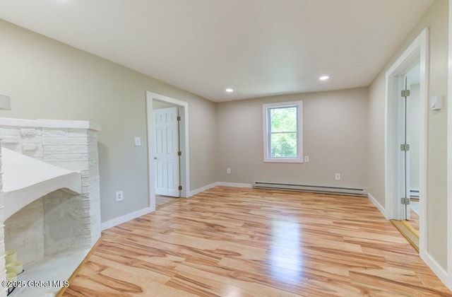 3956 Rte 9 W, Saugerties, NY 12477 - unfurnished living room with light wood-style flooring, a baseboard radiator, baseboard heating, recessed lighting, and baseboards
