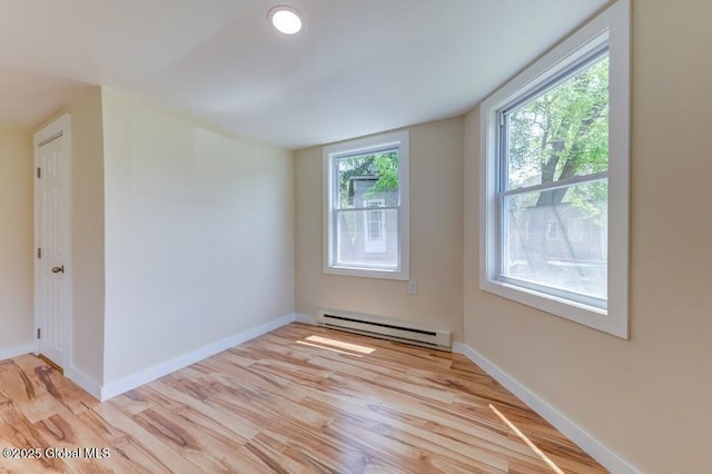 3956 Rte 9 W, Saugerties, NY 12477 - spare room featuring a baseboard heating unit, light wood-style flooring, and baseboards