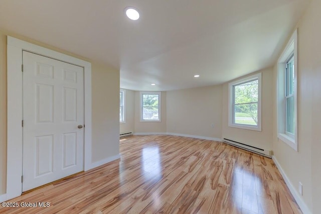 3956 Rte 9 W, Saugerties, NY 12477 - empty room featuring baseboard heating, light wood-type flooring, baseboards, and recessed lighting