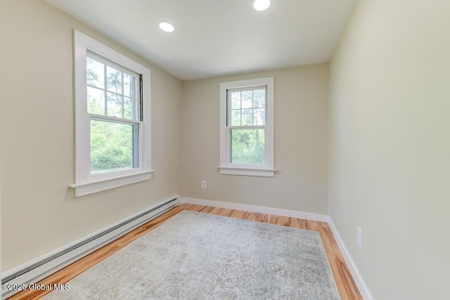 3956 Rte 9 W, Saugerties, NY 12477 - spare room with a baseboard heating unit, plenty of natural light, wood finished floors, baseboards, and recessed lighting