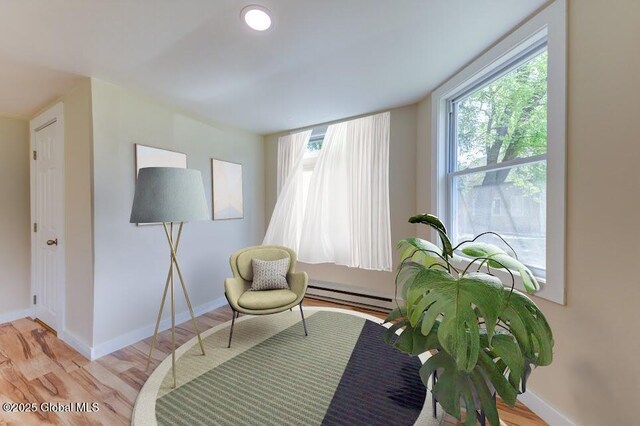 3956 Rte 9 W, Saugerties, NY 12477 - sitting room featuring a baseboard radiator, baseboards, and wood finished floors